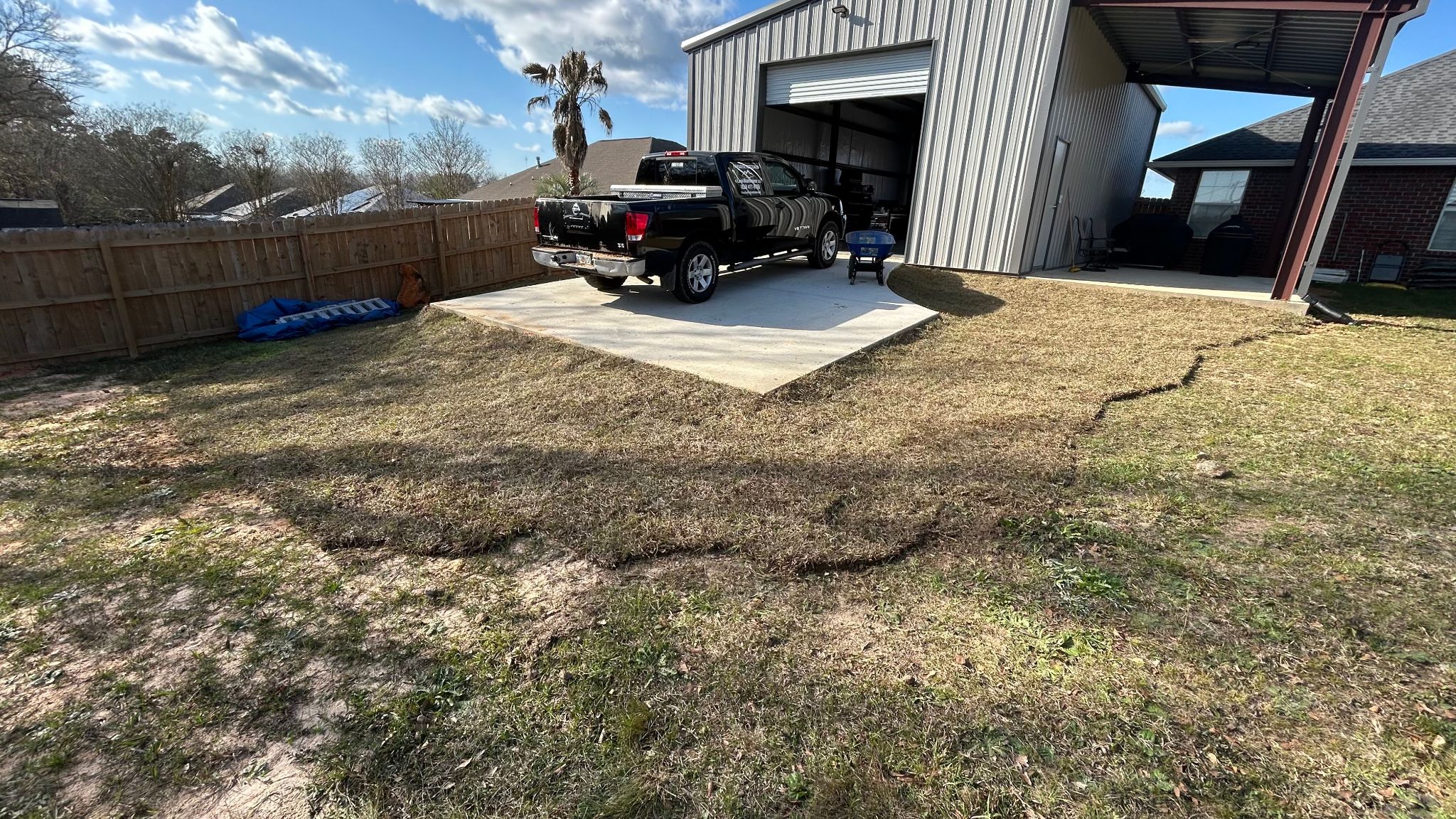 Yard with freshly installed sod by Paradise Restored Lawn Maintenance.